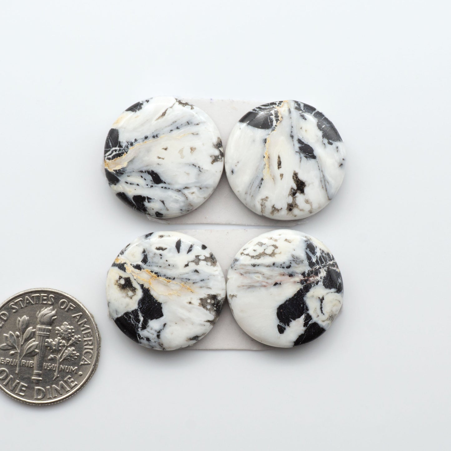 Natural White Buffalo Stone Cabochons are semi-precious gemstones cut into shapes ideal for jewelry-making, making them an excellent choice for artisans.