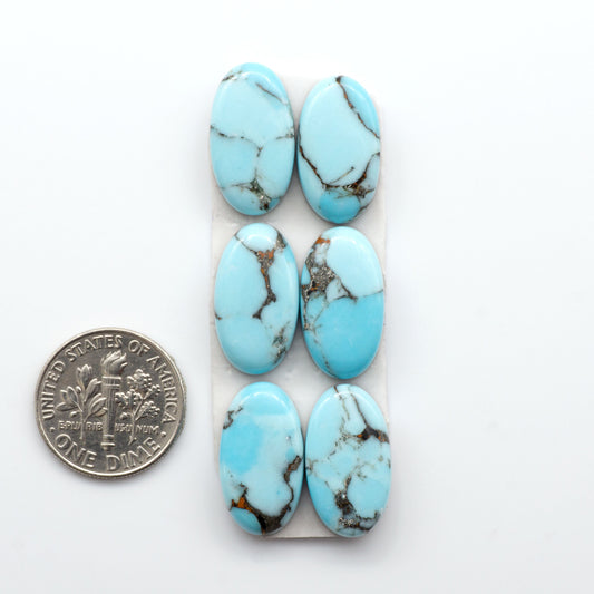 Enhance your jewelry designs with Pressed Turquoise Nugget Cabochons. Crafted from composite materials they add a captivating touch to your creations.