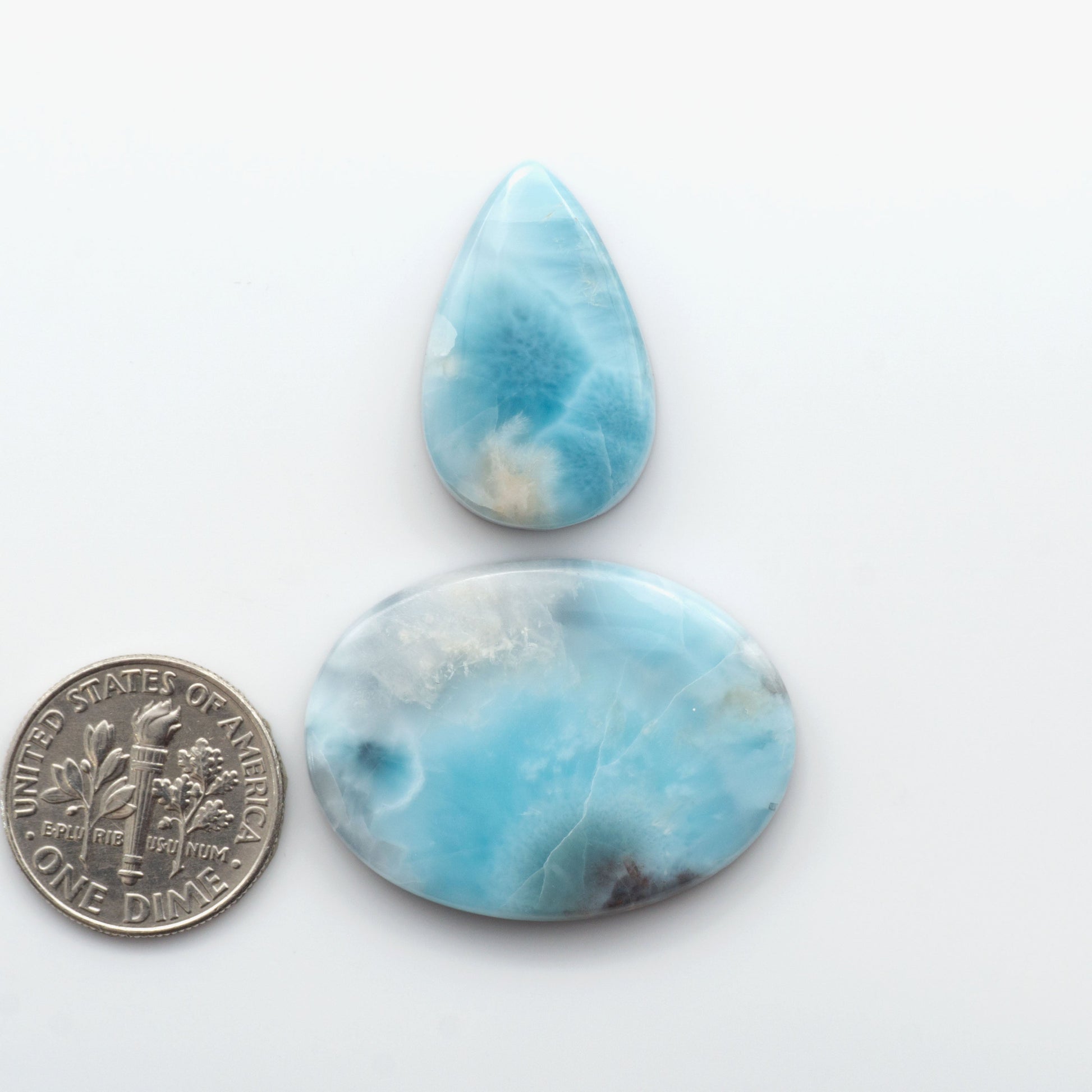 Discover the beauty of Larimar Cabochons. Cut to emphasize the stone's natural patterns and colors. Add a touch of natural beauty to your jewelry designs.