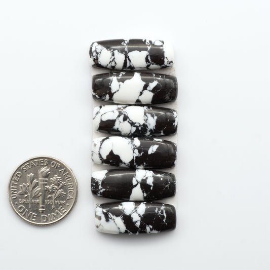 These White Buffalo Cabochons are expertly cut and polished from composite material, resulting in a stunning and long-lasting gemstone.

