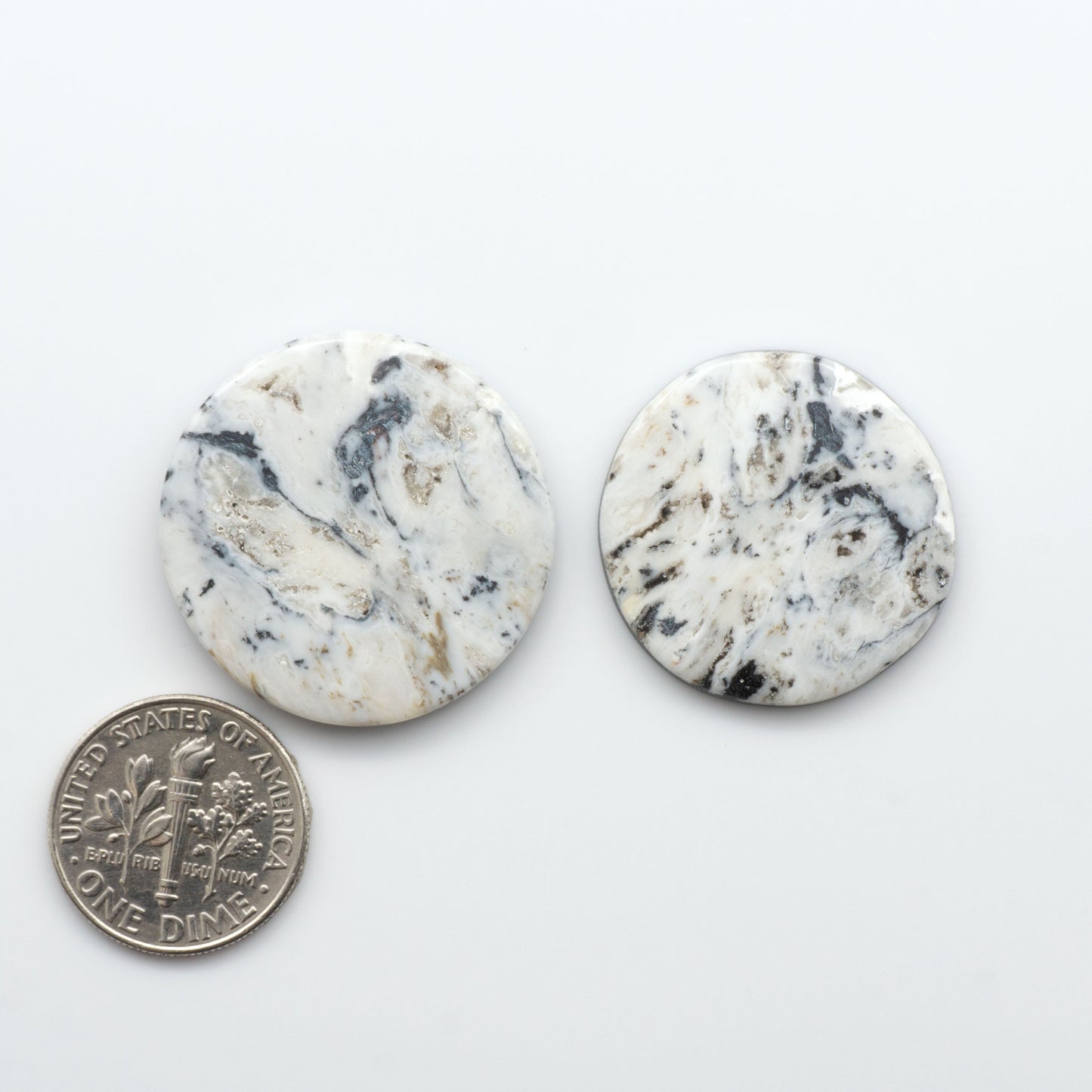 Natural White Buffalo Stone Cabochons are semi-precious gemstones cut into shapes ideal for jewelry-making, making them an excellent choice for artisans.