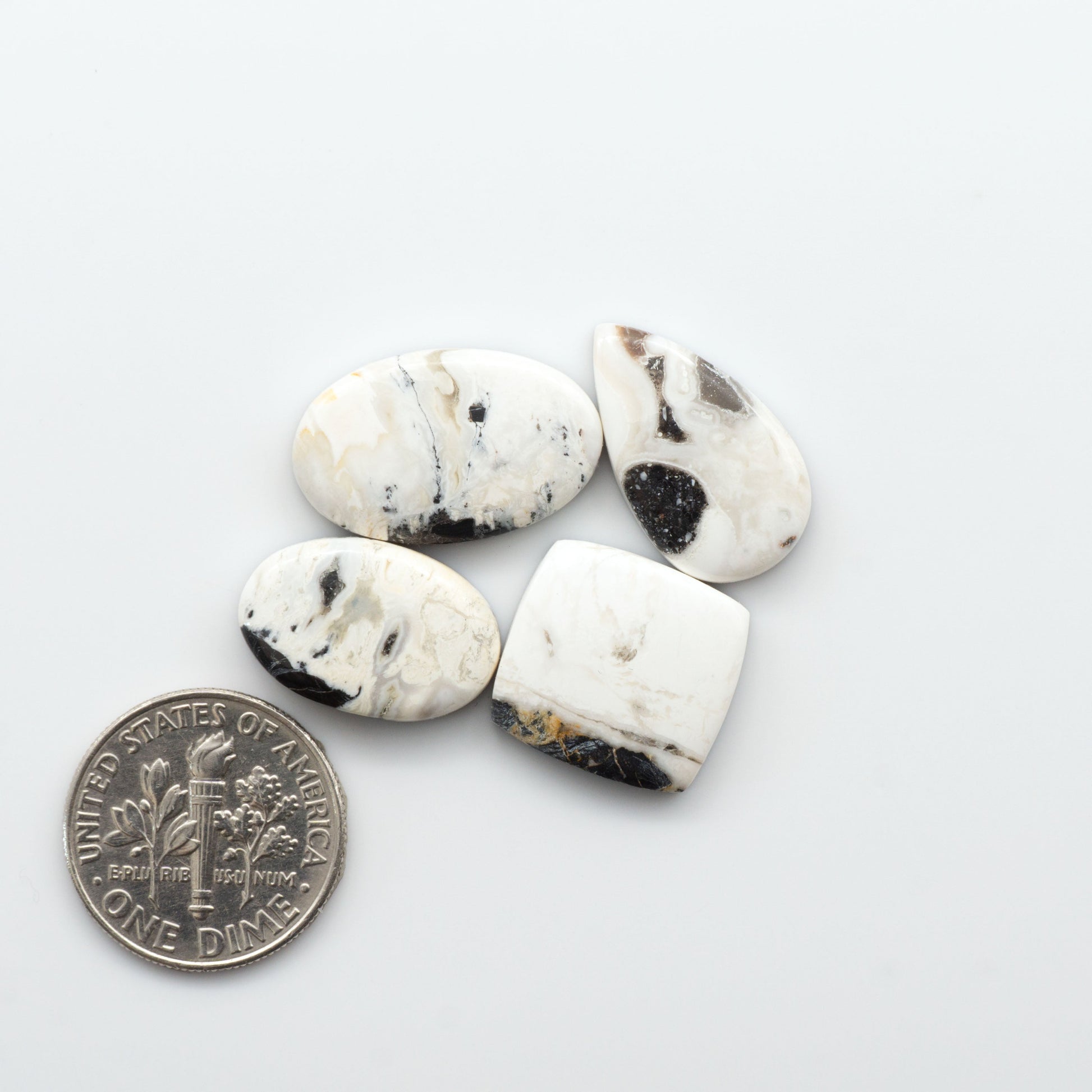 Natural White Buffalo Stone Cabochons are semi-precious gemstones cut into shapes ideal for jewelry-making, making them an excellent choice for artisans.