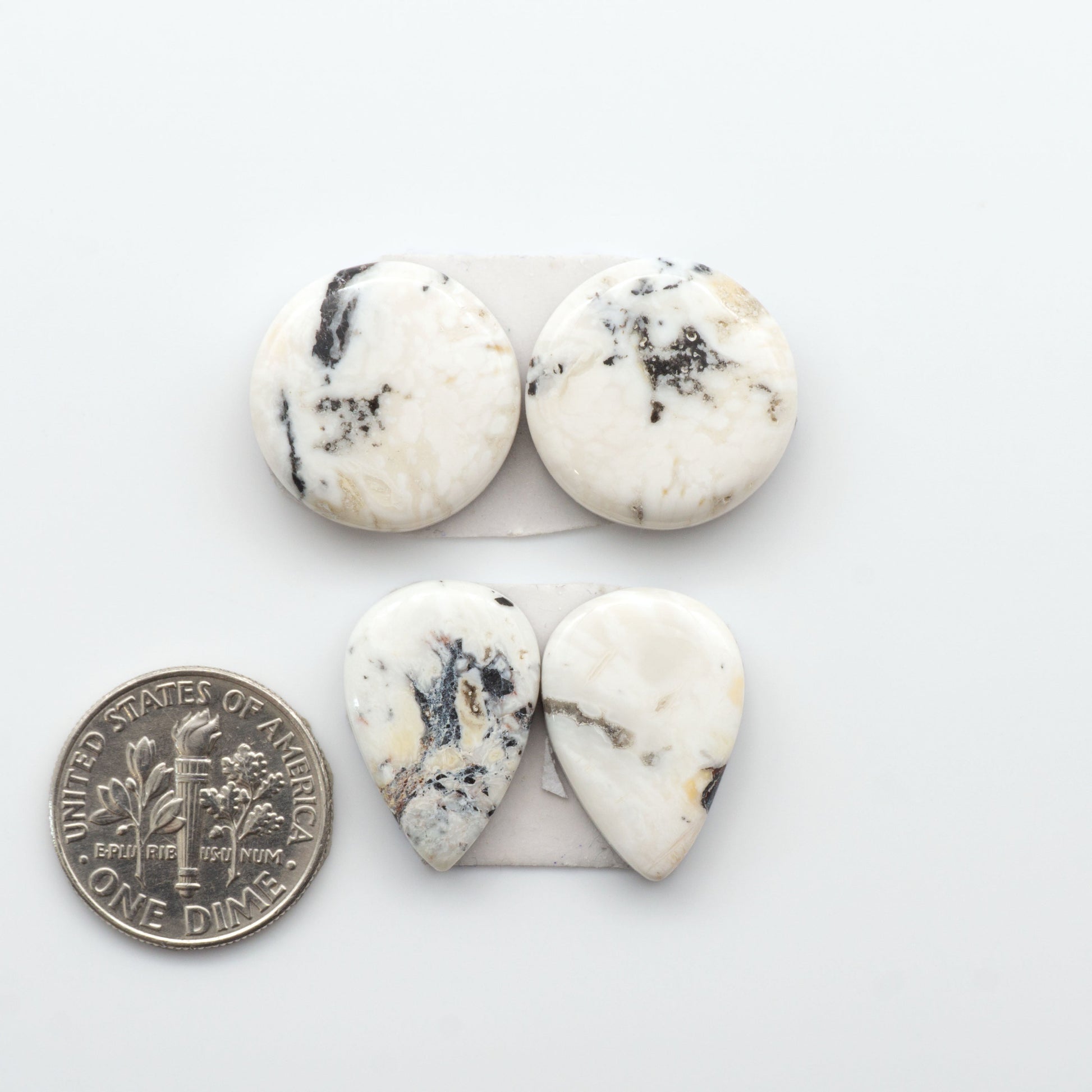 Natural White Buffalo Stone Cabochons are semi-precious gemstones cut into shapes ideal for jewelry-making, making them an excellent choice for artisans.