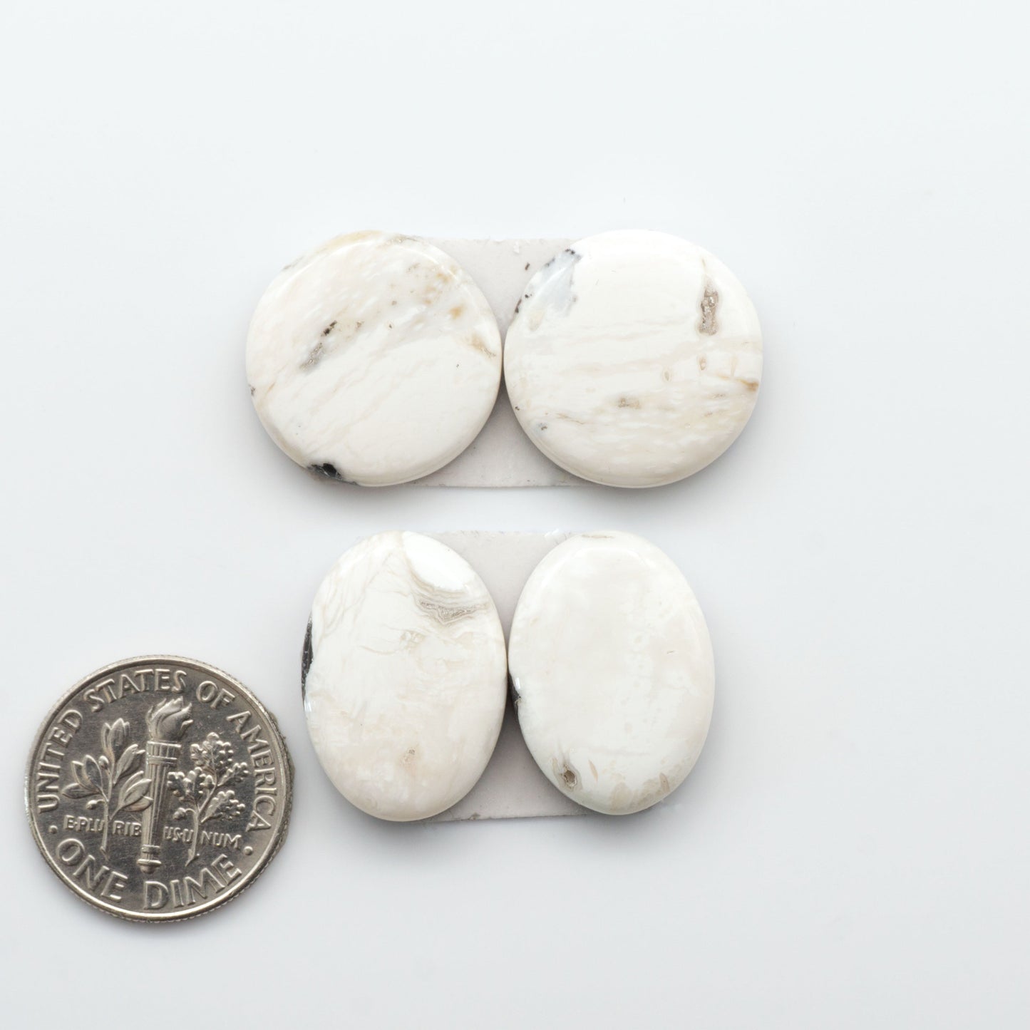 Natural White Buffalo Stone Cabochons are semi-precious gemstones cut into shapes ideal for jewelry-making, making them an excellent choice for artisans.