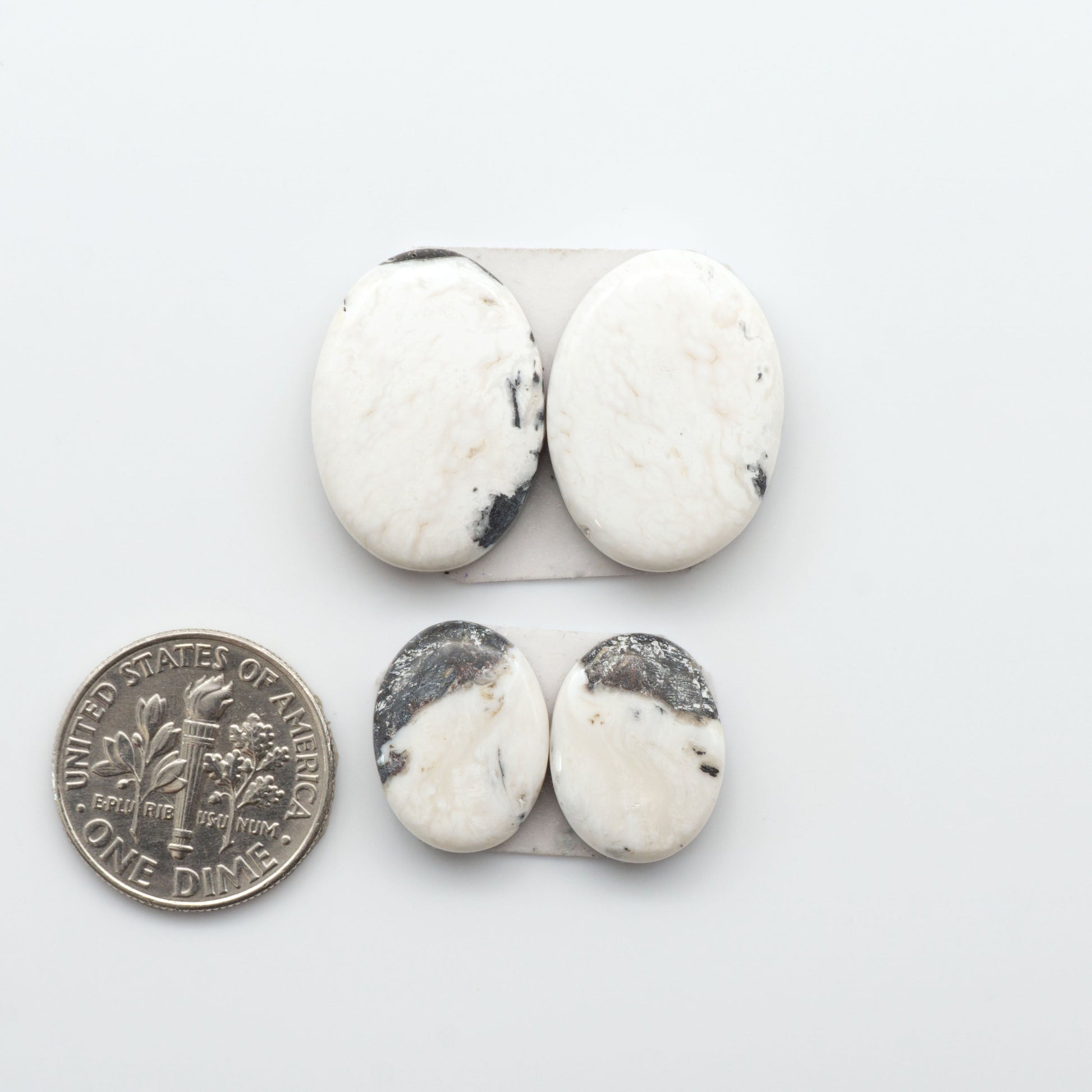 Natural White Buffalo Stone Cabochons are semi-precious gemstones cut into shapes ideal for jewelry-making, making them an excellent choice for artisans.