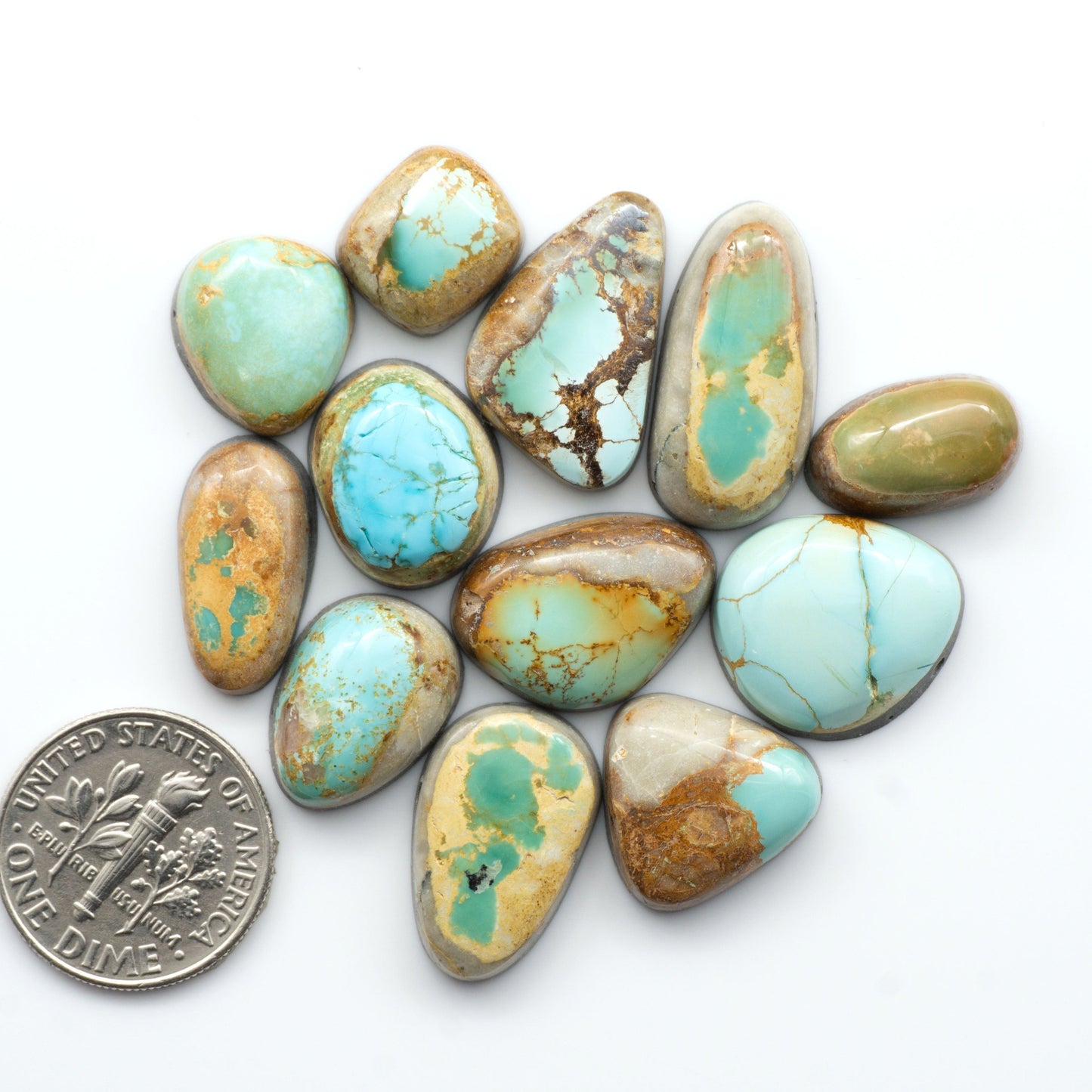 Royston Turquoise cabochons are famous for their distinctive matrix and unique green and blue hues, making them a favored option among jewelry designers.