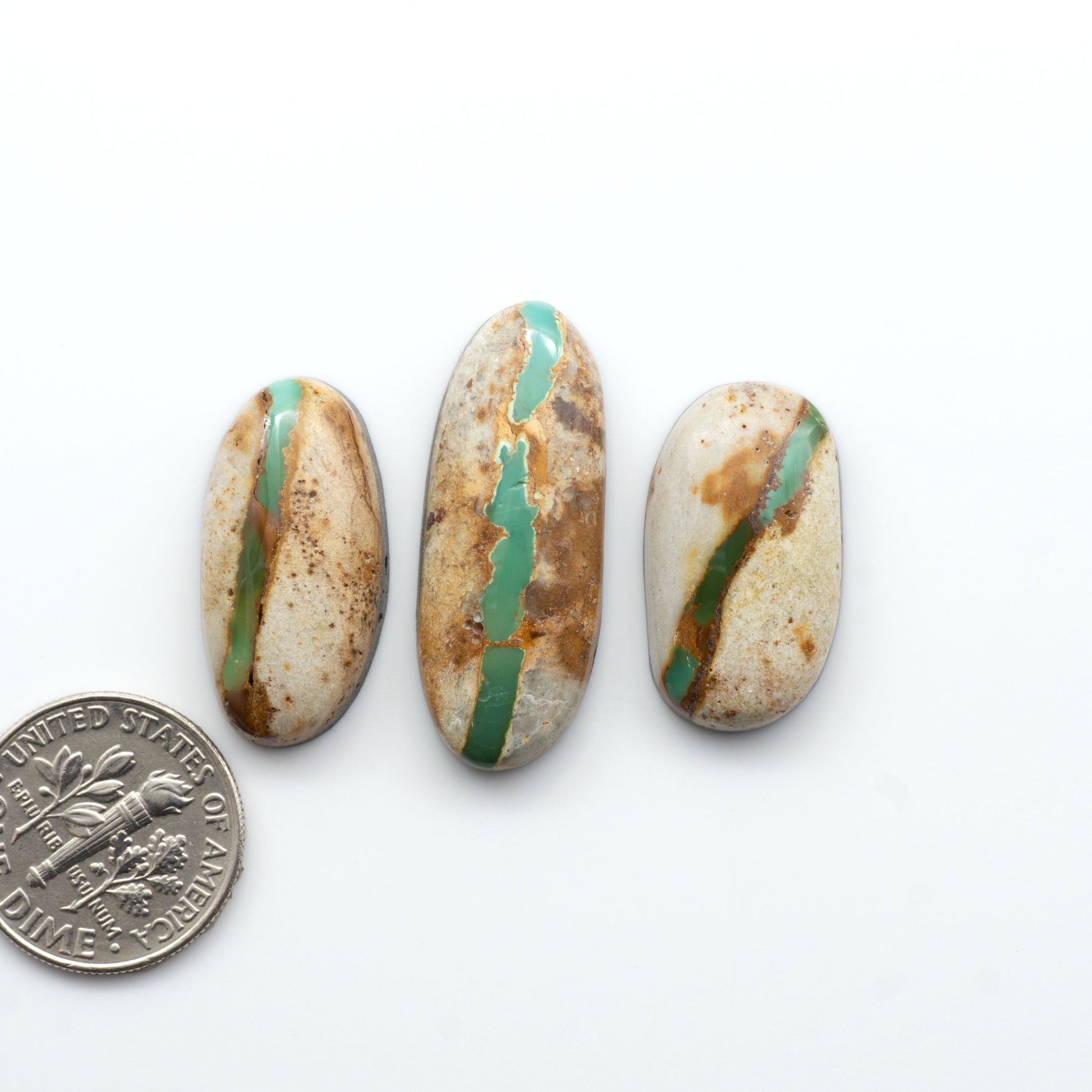 Royston Turquoise cabochons are famous for their distinctive matrix and unique green and blue hues, making them a favored option among jewelry designers.