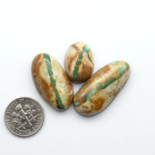 Royston Turquoise cabochons are famous for their distinctive matrix and unique green and blue hues, making them a favored option among jewelry designers.