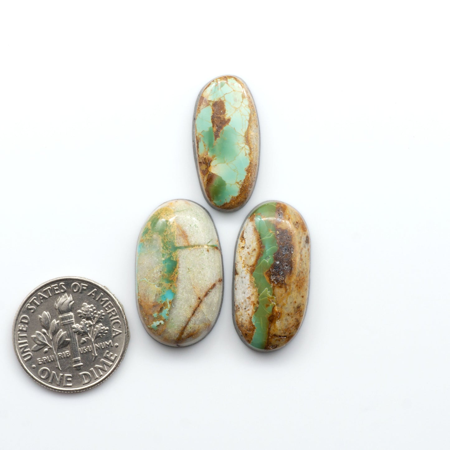 Royston Turquoise cabochons are famous for their distinctive matrix and unique green and blue hues, making them a favored option among jewelry designers.