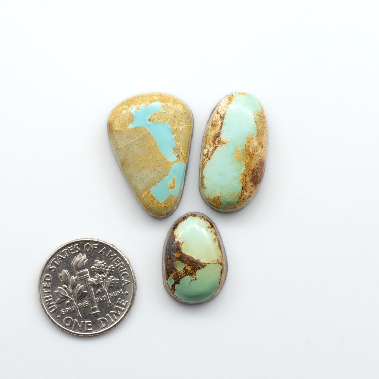 Royston Turquoise cabochons are famous for their distinctive matrix and unique green and blue hues, making them a favored option among jewelry designers.