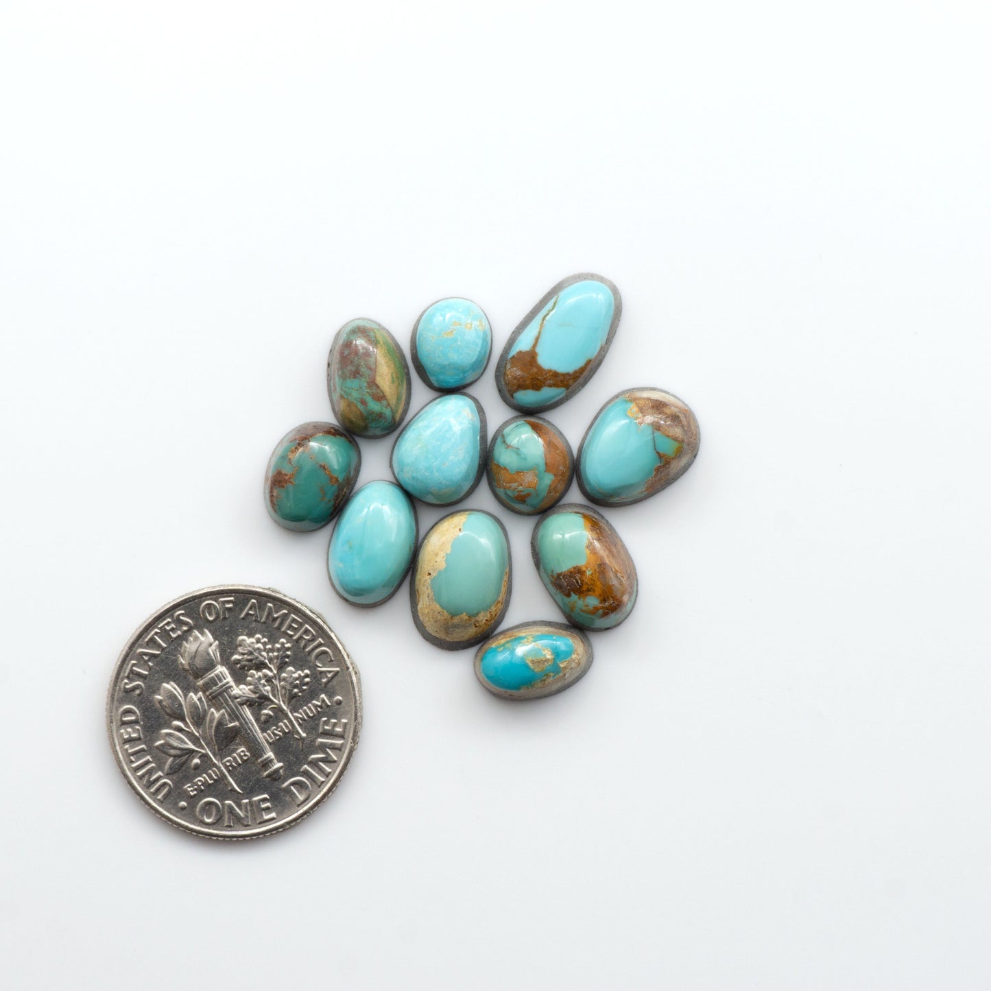 Royston Turquoise cabochons are famous for their distinctive matrix and unique green and blue hues, making them a favored option among jewelry designers.