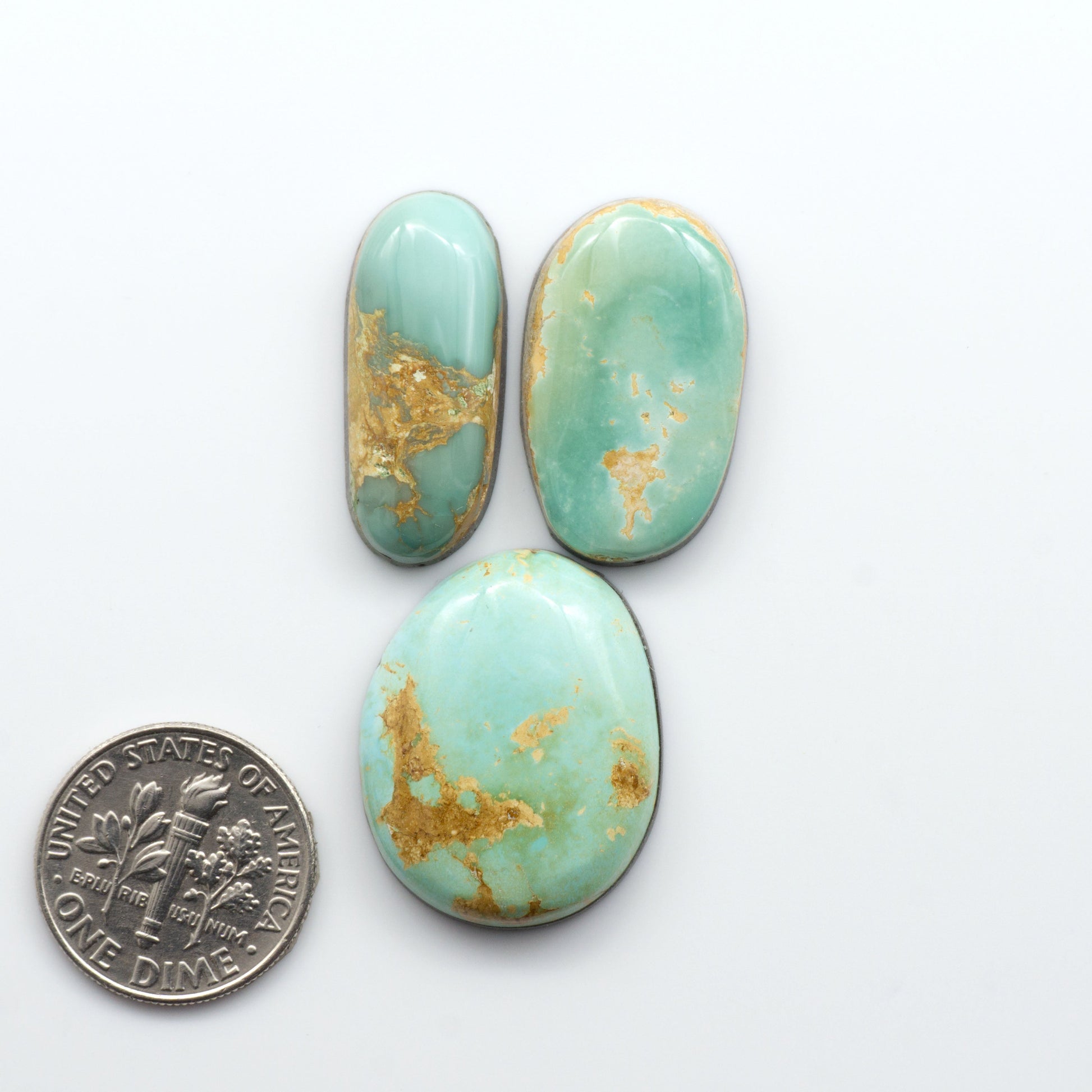 Royston Turquoise cabochons are famous for their distinctive matrix and unique green and blue hues, making them a favored option among jewelry designers.