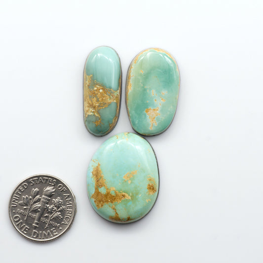 Royston Turquoise cabochons are famous for their distinctive matrix and unique green and blue hues, making them a favored option among jewelry designers.