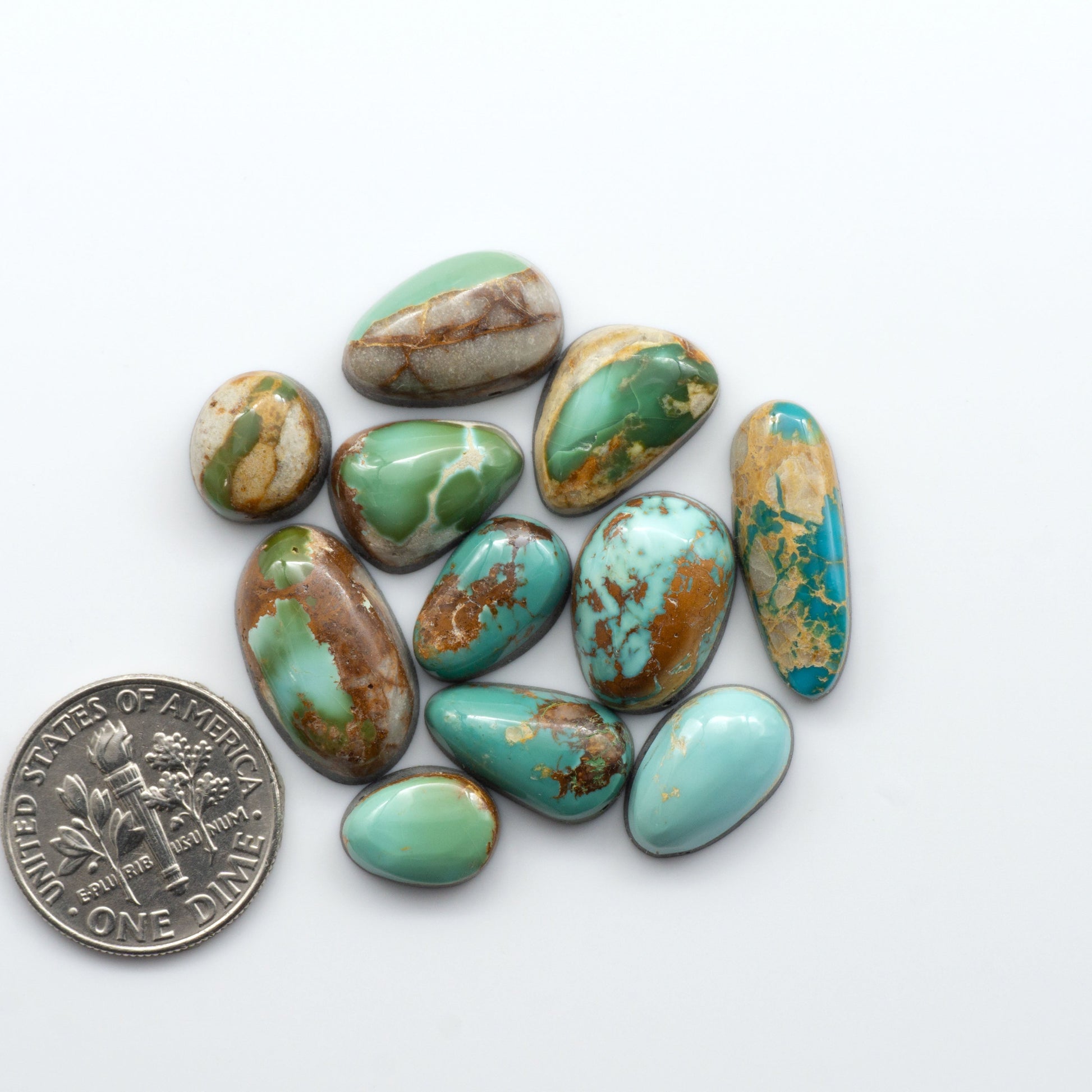 Royston Turquoise cabochons are famous for their distinctive matrix and unique green and blue hues, making them a favored option among jewelry designers.