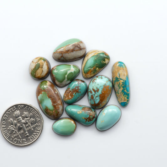 Royston Turquoise cabochons are famous for their distinctive matrix and unique green and blue hues, making them a favored option among jewelry designers.