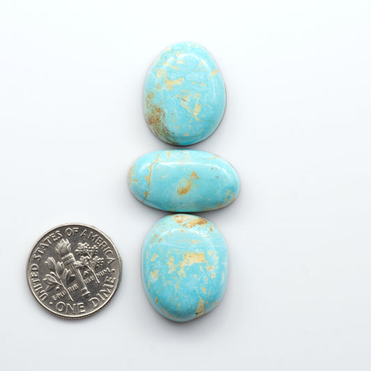 Royston Turquoise cabochons are famous for their distinctive matrix and unique green and blue hues, making them a favored option among jewelry designers.