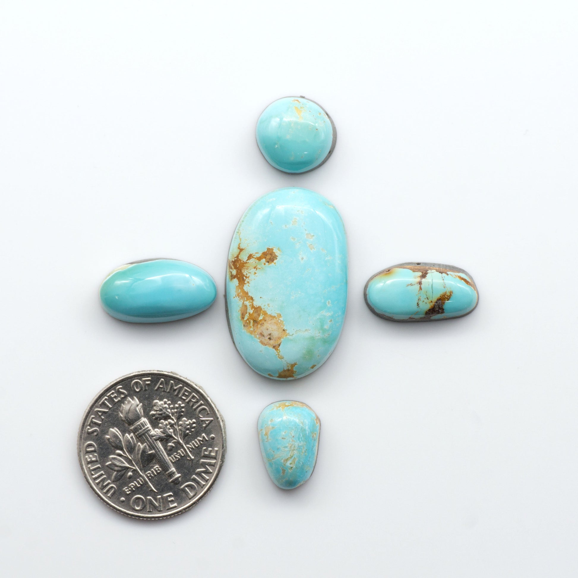 Royston Turquoise cabochons are famous for their distinctive matrix and unique green and blue hues, making them a favored option among jewelry designers.