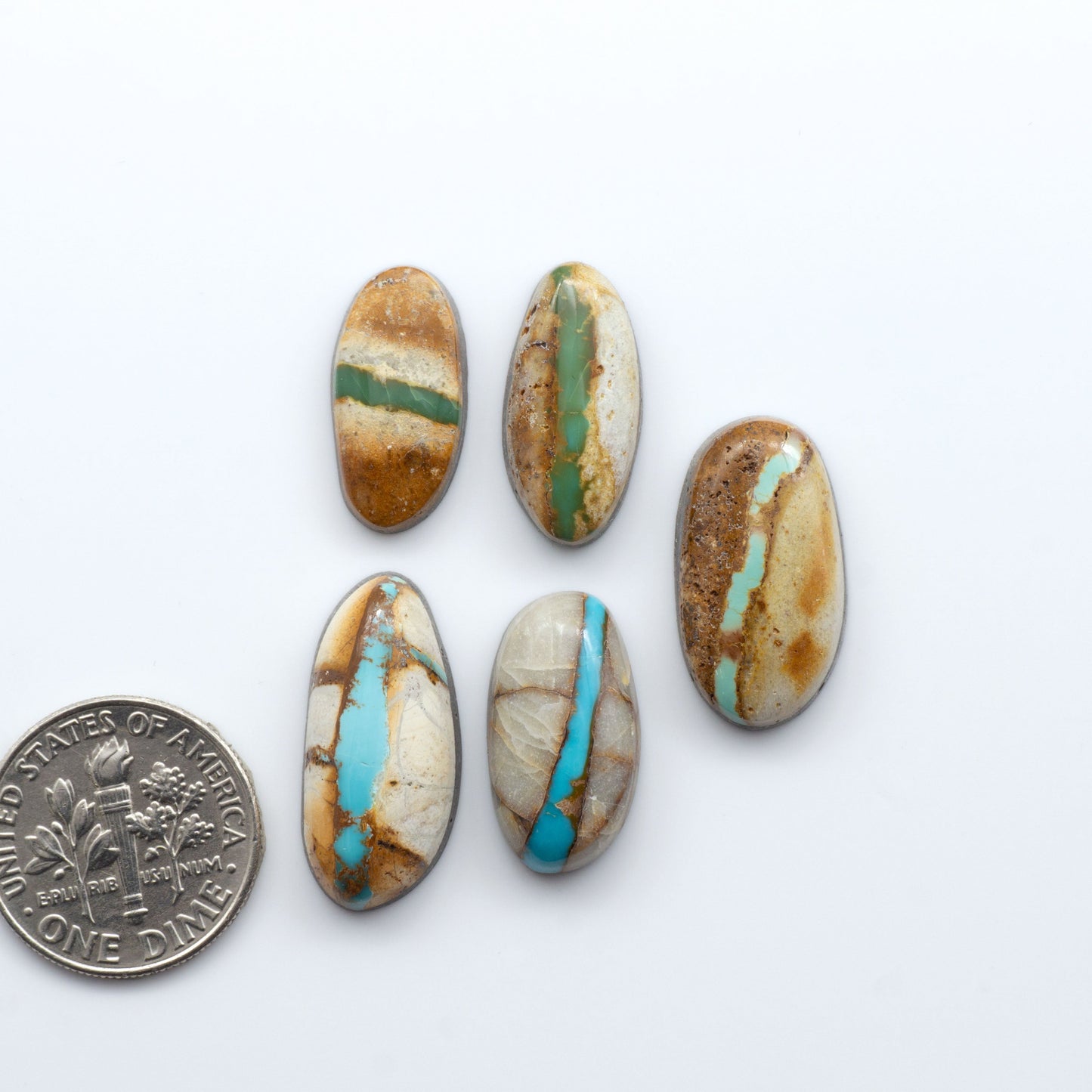 Royston Turquoise cabochons are famous for their distinctive matrix and unique green and blue hues, making them a favored option among jewelry designers.