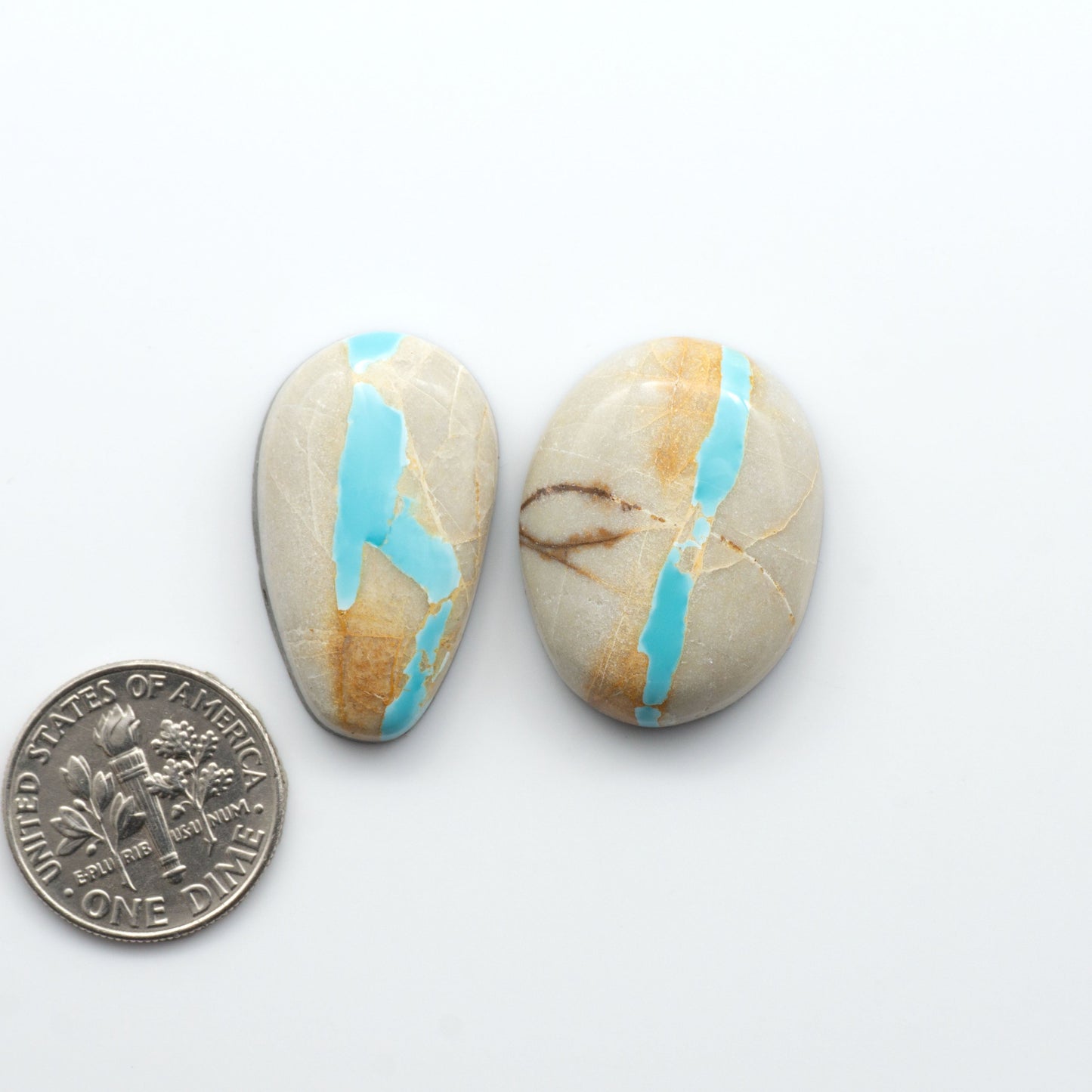 Royston Turquoise cabochons are famous for their distinctive matrix and unique green and blue hues, making them a favored option among jewelry designers.