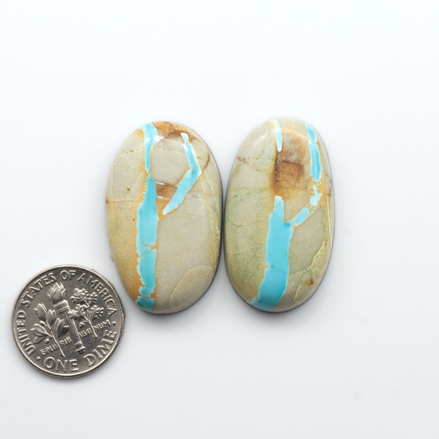 Royston Turquoise cabochons are famous for their distinctive matrix and unique green and blue hues, making them a favored option among jewelry designers.