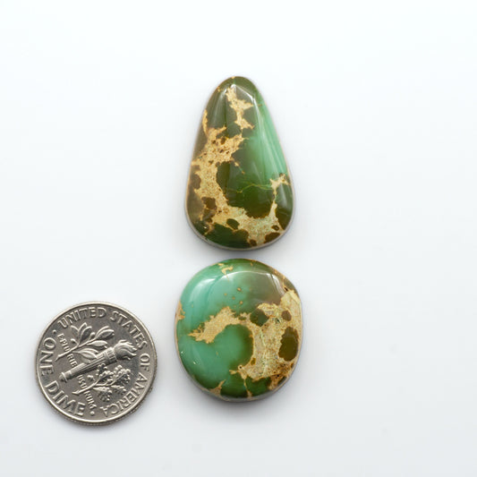 Royston Turquoise cabochons are famous for their distinctive matrix and unique green and blue hues, making them a favored option among jewelry designers.