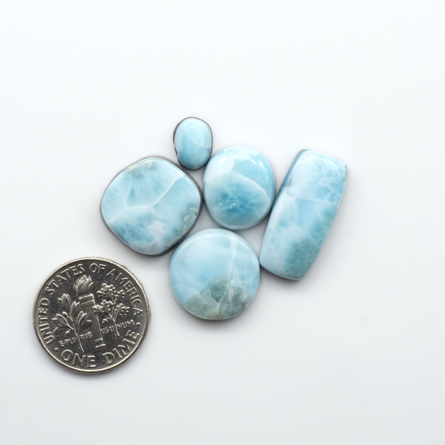 Discover the beauty of Larimar Cabochons. Cut to emphasize the stone's natural patterns and colors. Add a touch of natural beauty to your jewelry designs.