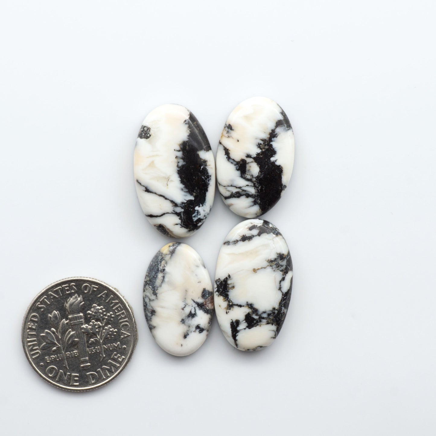 Natural White Buffalo Stone Cabochons are semi-precious gemstones cut into shapes ideal for jewelry-making, making them an excellent choice for artisans.