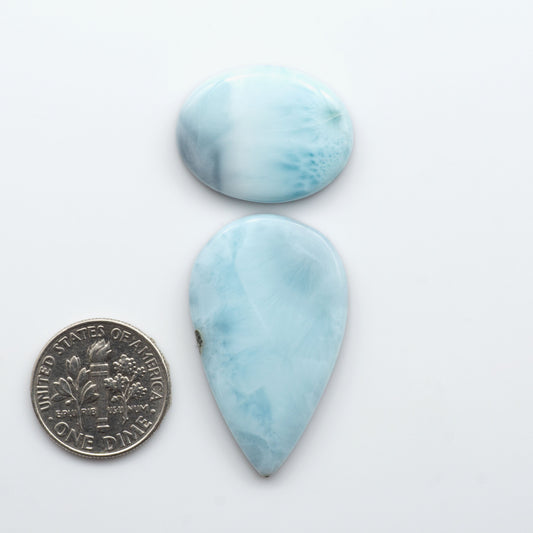 Discover the beauty of Larimar Cabochons. Cut to emphasize the stone's natural patterns and colors. Add a touch of natural beauty to your jewelry designs.