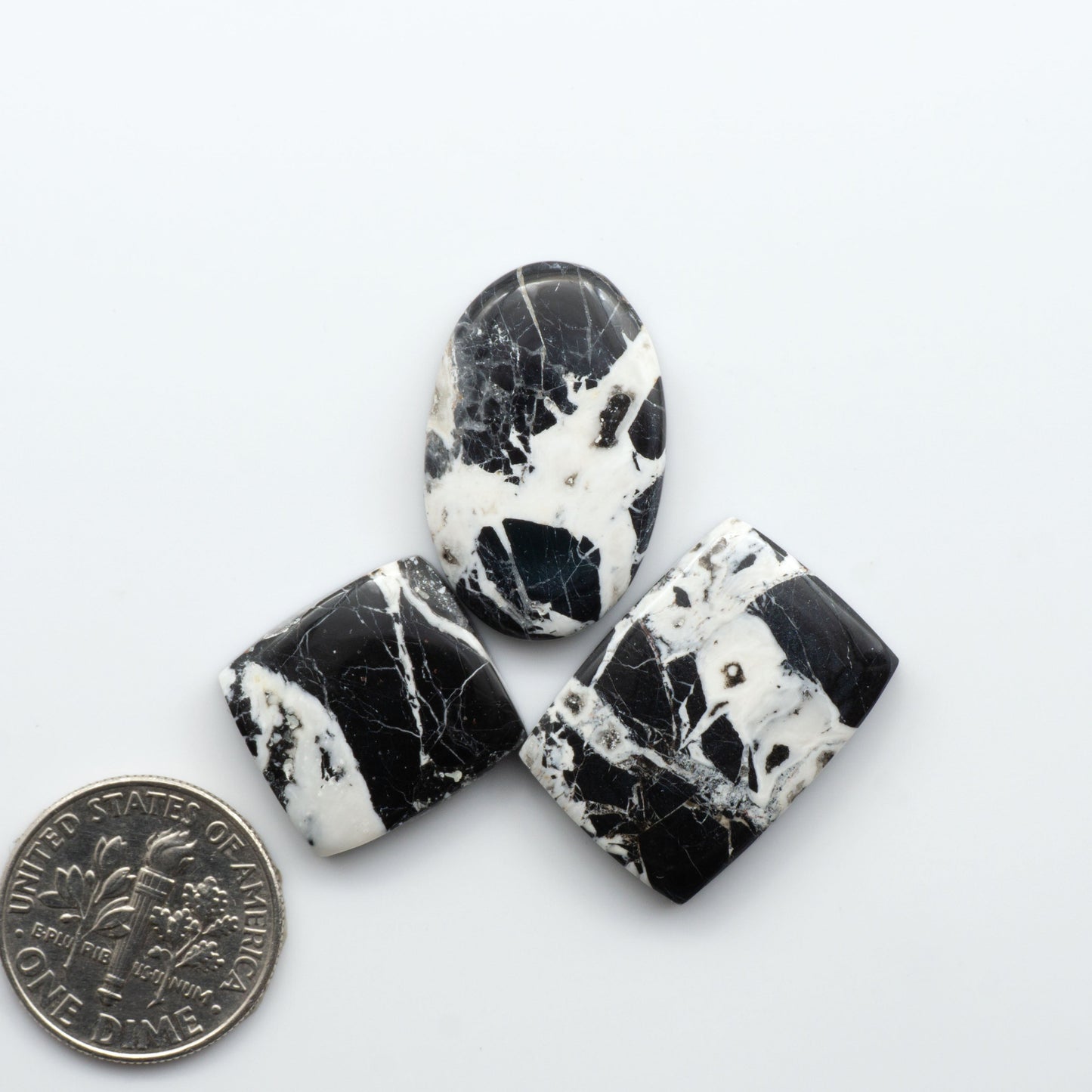 Natural White Buffalo Stone Cabochons are semi-precious gemstones cut into shapes ideal for jewelry-making, making them an excellent choice for artisans.