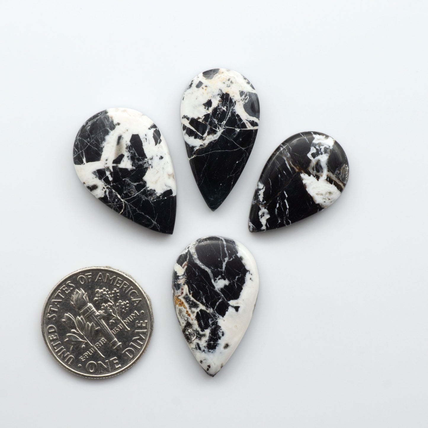 Natural White Buffalo Stone Cabochons are semi-precious gemstones cut into shapes ideal for jewelry-making, making them an excellent choice for artisans.