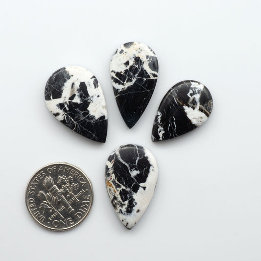 Natural White Buffalo Stone Cabochons are semi-precious gemstones cut into shapes ideal for jewelry-making, making them an excellent choice for artisans.