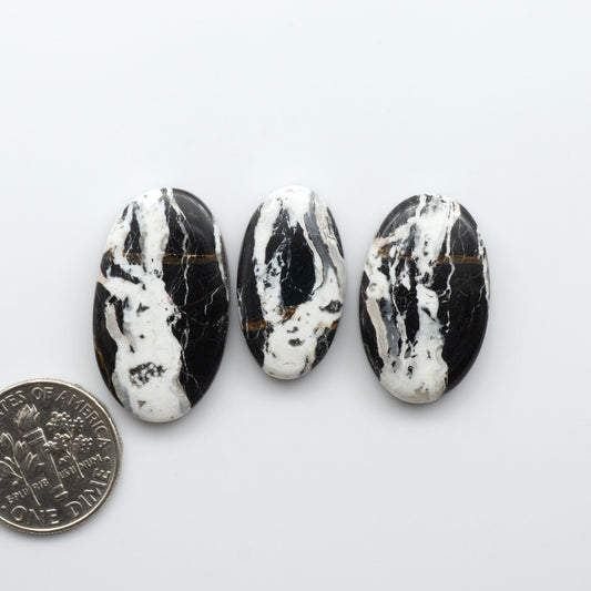 Natural White Buffalo Stone Cabochons are semi-precious gemstones cut into shapes ideal for jewelry-making, making them an excellent choice for artisans.