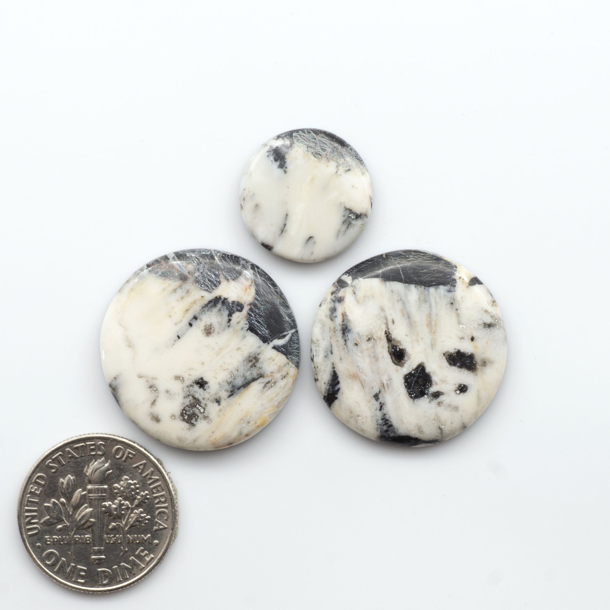 Natural White Buffalo Stone Cabochons are semi-precious gemstones cut into shapes ideal for jewelry-making, making them an excellent choice for artisans.