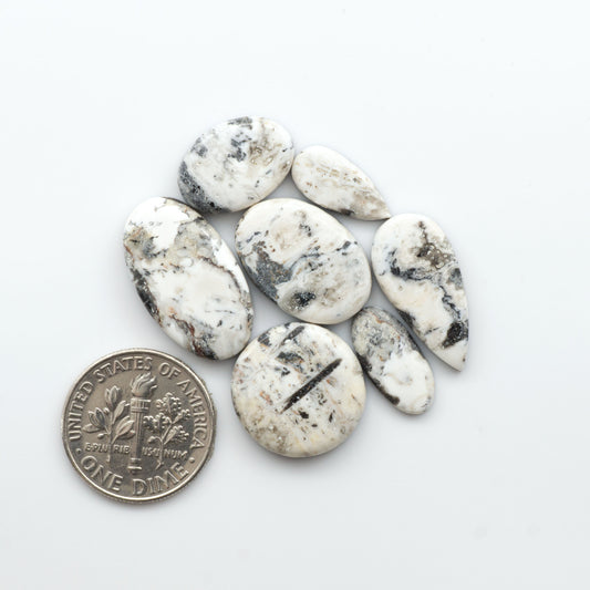 Natural White Buffalo Stone Cabochons are semi-precious gemstones cut into shapes ideal for jewelry-making, making them an excellent choice for artisans.