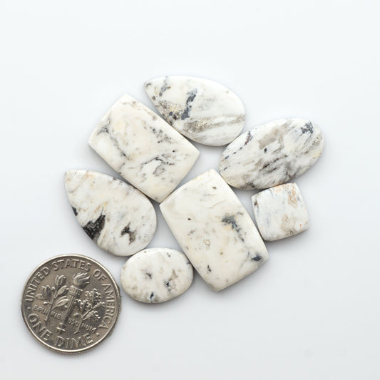 Natural White Buffalo Stone Cabochons are semi-precious gemstones cut into shapes ideal for jewelry-making, making them an excellent choice for artisans.