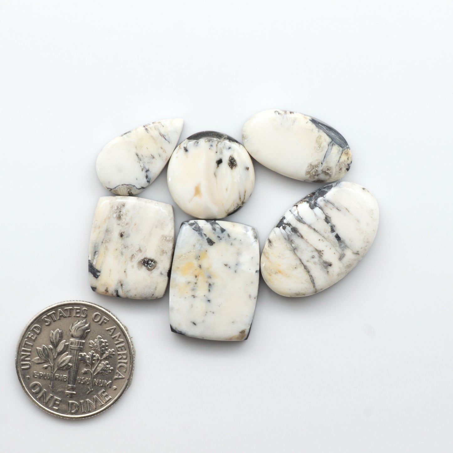 Natural White Buffalo Stone Cabochons are semi-precious gemstones cut into shapes ideal for jewelry-making, making them an excellent choice for artisans.