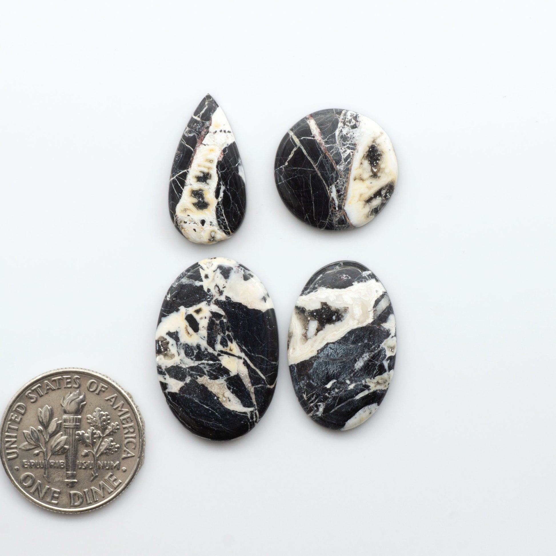 Natural White Buffalo Stone Cabochons are semi-precious gemstones cut into shapes ideal for jewelry-making, making them an excellent choice for artisans.