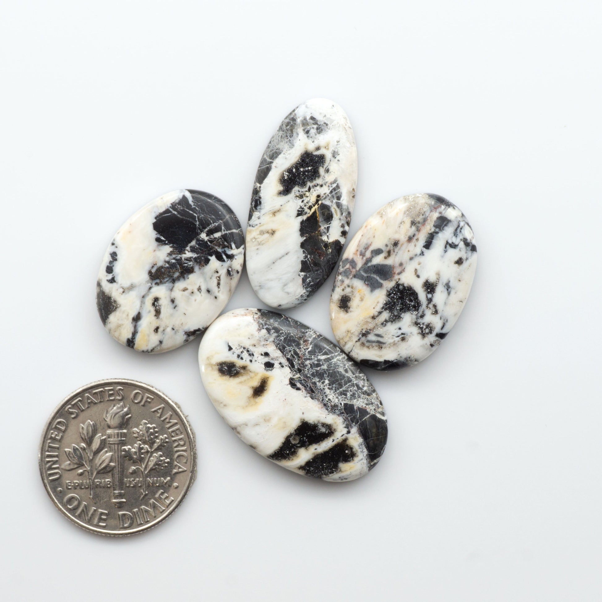 Natural White Buffalo Stone Cabochons are semi-precious gemstones cut into shapes ideal for jewelry-making, making them an excellent choice for artisans.