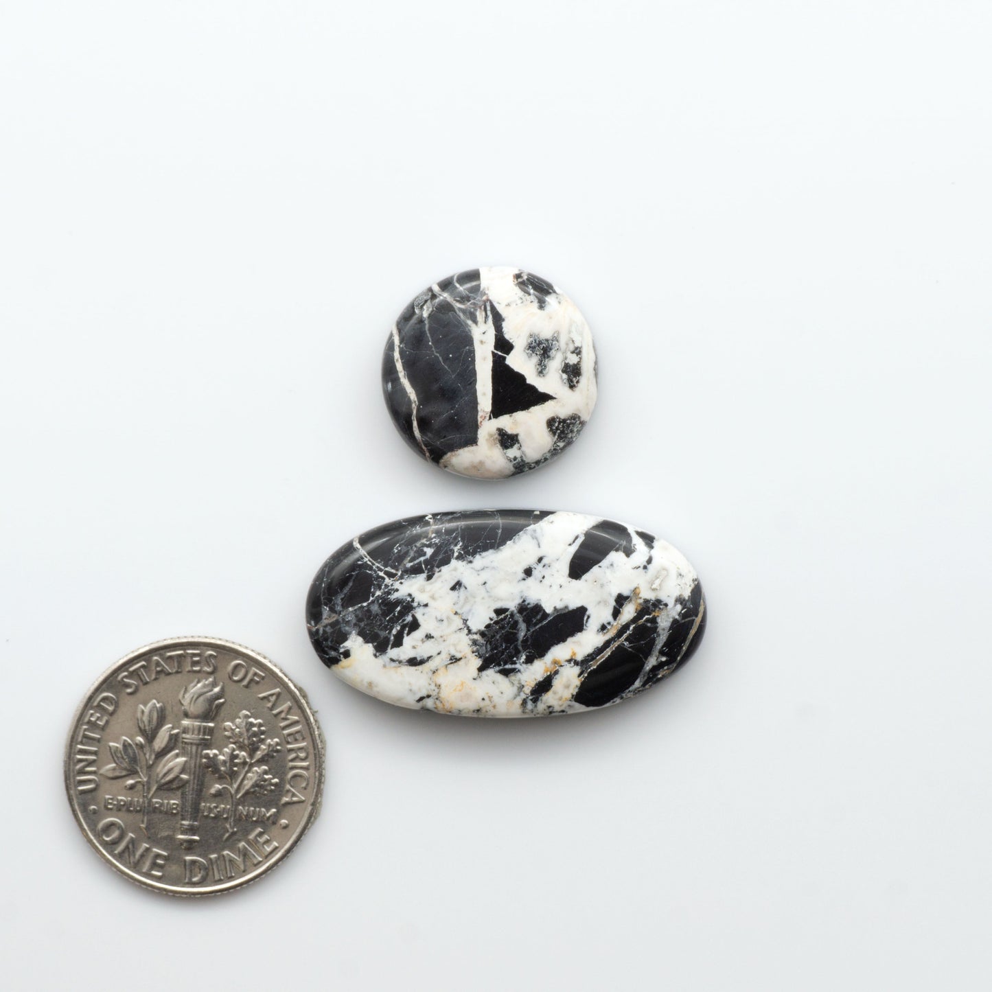 Natural White Buffalo Stone Cabochons are semi-precious gemstones cut into shapes ideal for jewelry-making, making them an excellent choice for artisans.