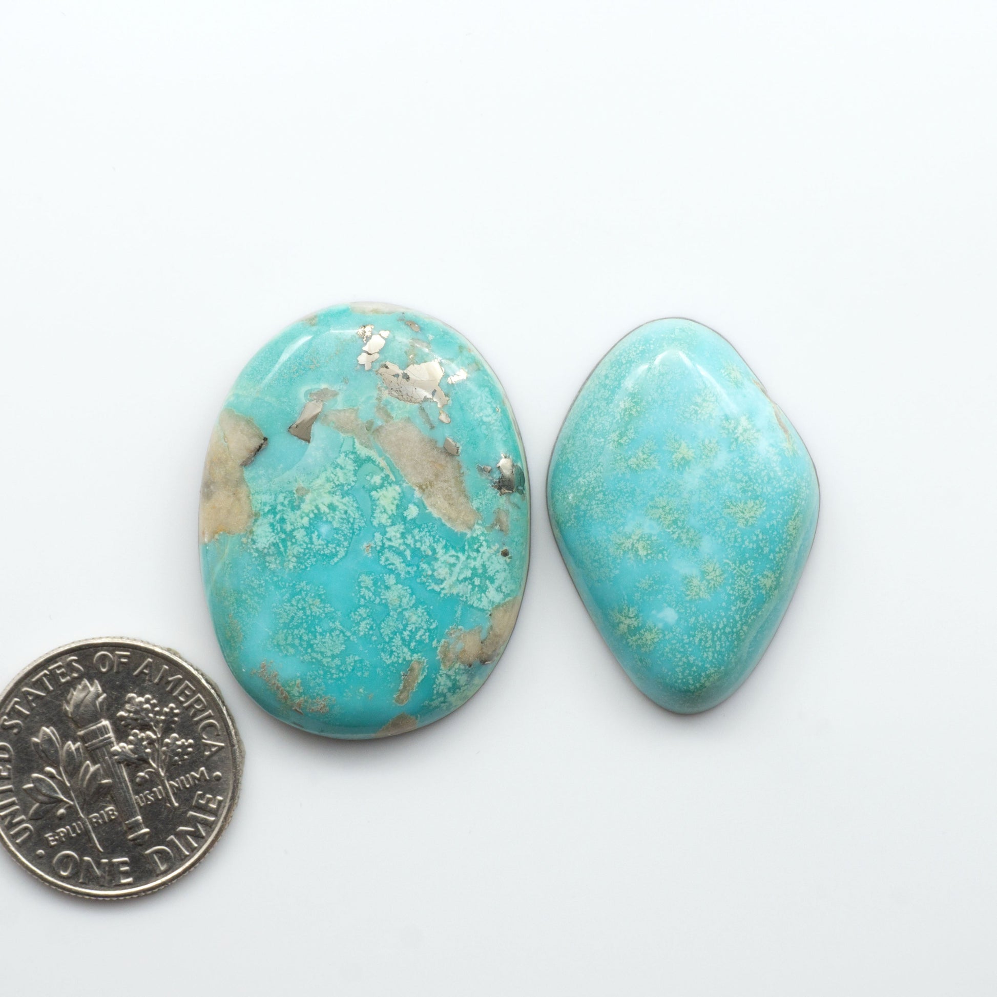 Nacozari turquoise cabochons are striking gemstones known for their vibrant blue to greenish-blue colors and pyrite, these stones are prized in jewelry making.