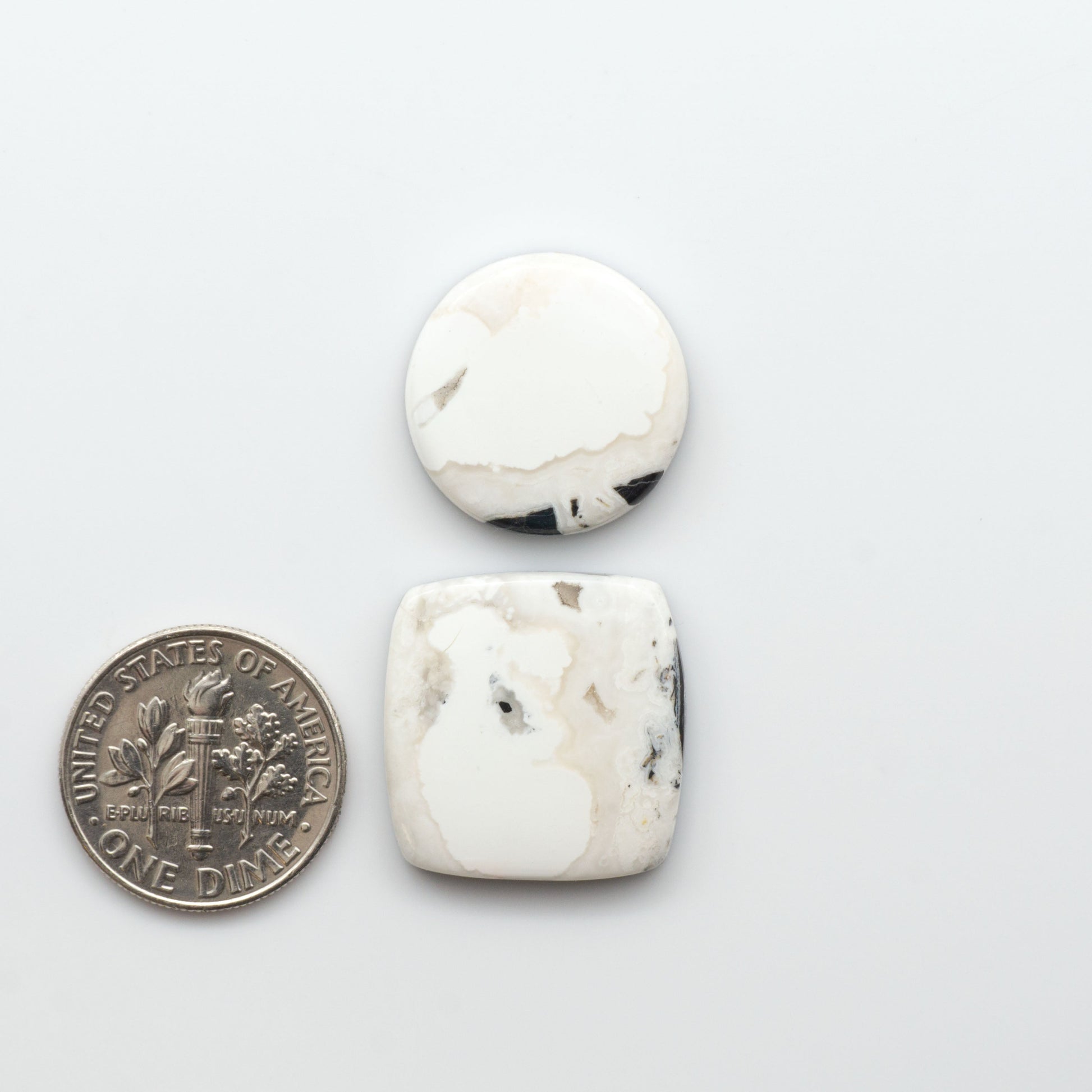 Natural White Buffalo Stone Cabochons are semi-precious gemstones cut into shapes ideal for jewelry-making, making them an excellent choice for artisans.

