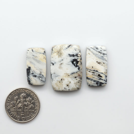 Natural White Buffalo Stone Cabochons are semi-precious gemstones cut into shapes ideal for jewelry-making, making them an excellent choice for artisans.

