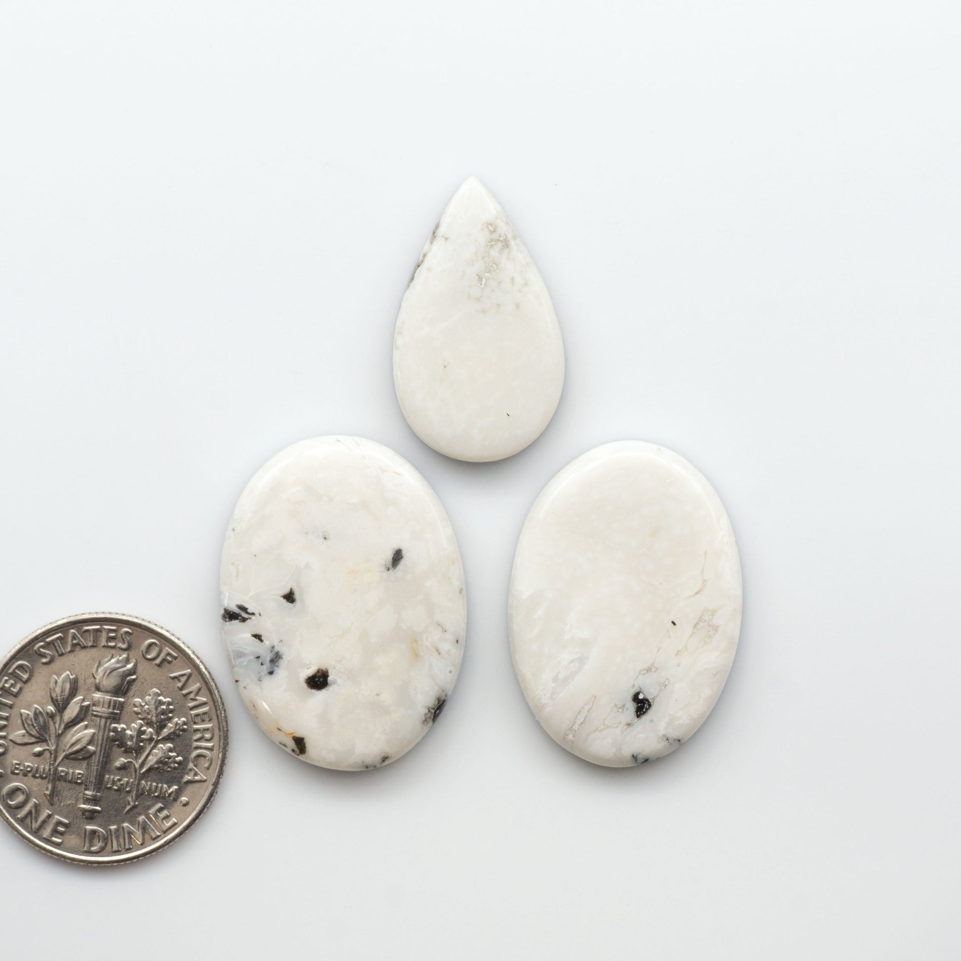 Natural White Buffalo Stone Cabochons are semi-precious gemstones cut into shapes ideal for jewelry-making, making them an excellent choice for artisans.

