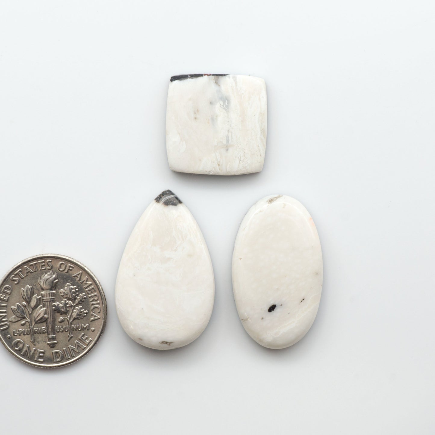 Natural White Buffalo Stone Cabochons are semi-precious gemstones cut into shapes ideal for jewelry-making, making them an excellent choice for artisans.

