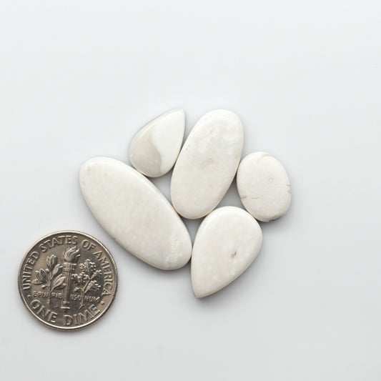 Natural White Buffalo Stone Cabochons are semi-precious gemstones cut into shapes ideal for jewelry-making, making them an excellent choice for artisans.

