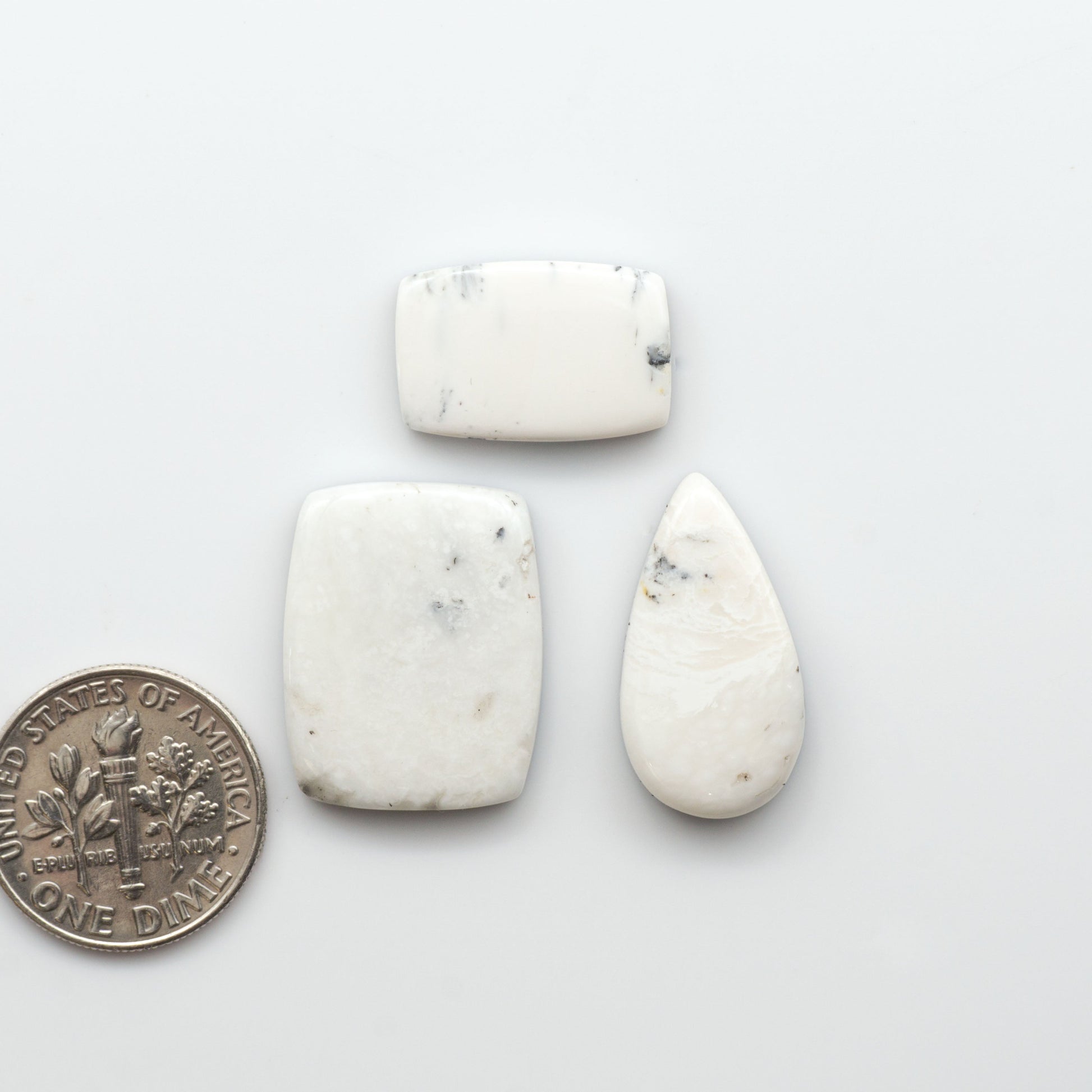 Natural White Buffalo Stone Cabochons are semi-precious gemstones cut into shapes ideal for jewelry-making, making them an excellent choice for artisans.

