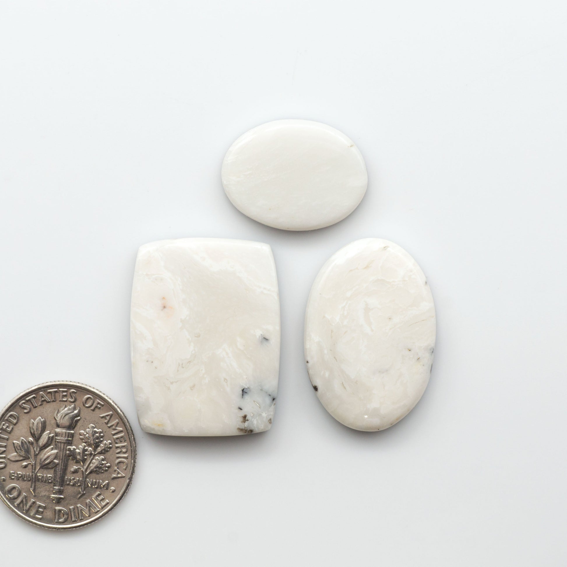 Natural White Buffalo Stone Cabochons are semi-precious gemstones cut into shapes ideal for jewelry-making, making them an excellent choice for artisans.

