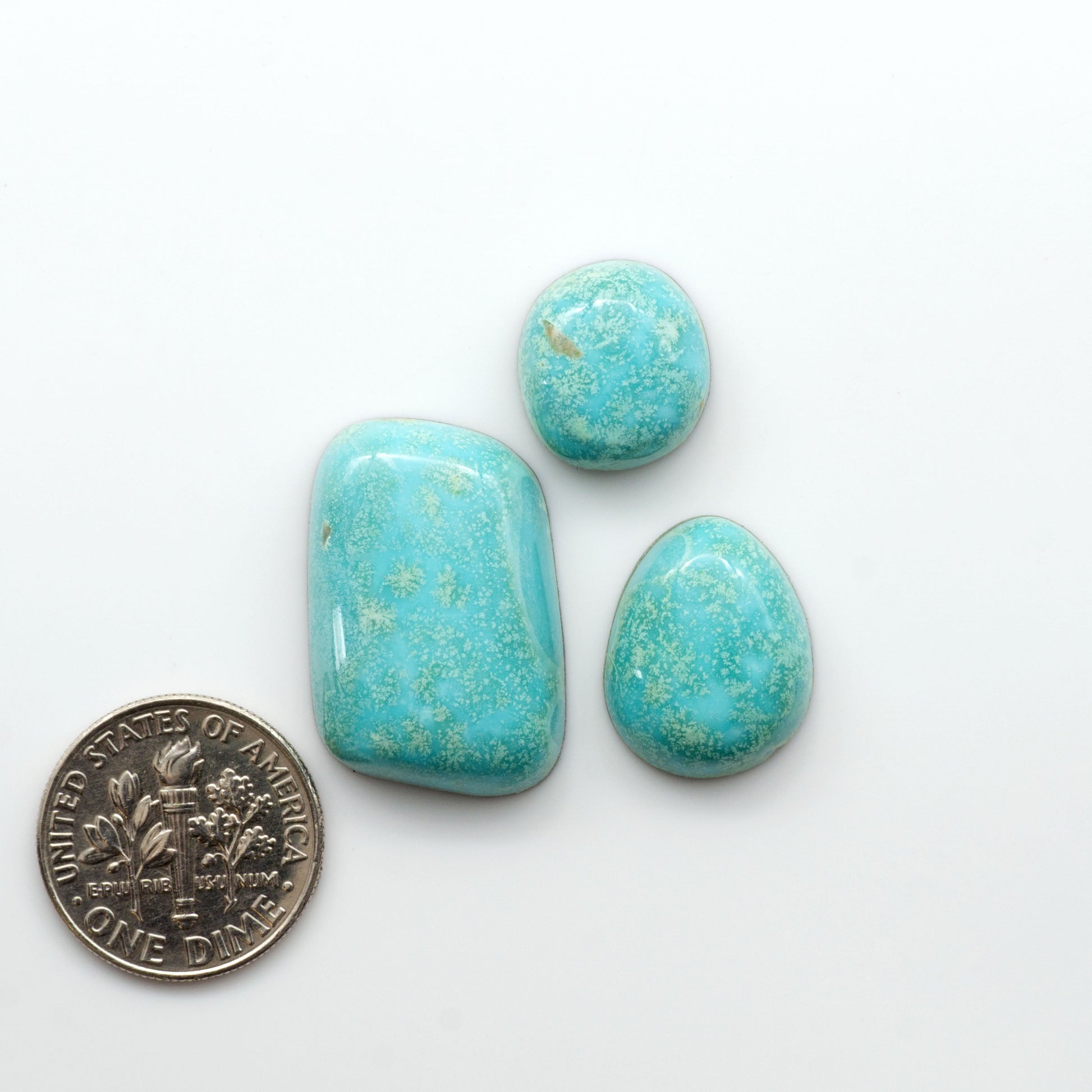 Nacozari turquoise cabochons are striking gemstones known for their vibrant blue to greenish-blue colors and pyrite, these stones are prized in jewelry making.