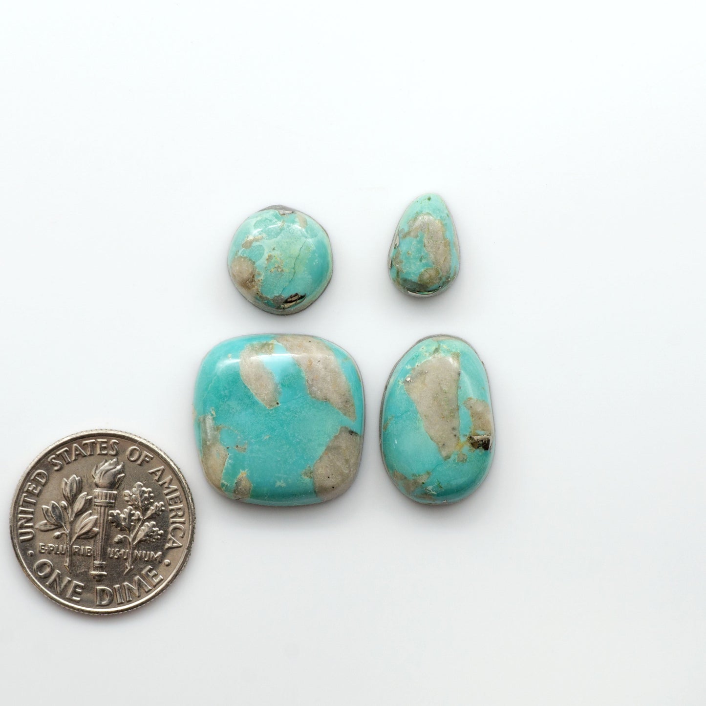 Nacozari turquoise cabochons are striking gemstones known for their vibrant blue to greenish-blue colors and pyrite, these stones are prized in jewelry making.